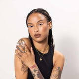 Women wearing gold chain necklace